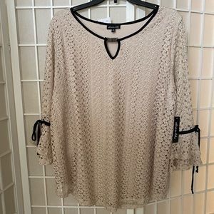 Brand new with tags still on ladies top works for the office or a night out.